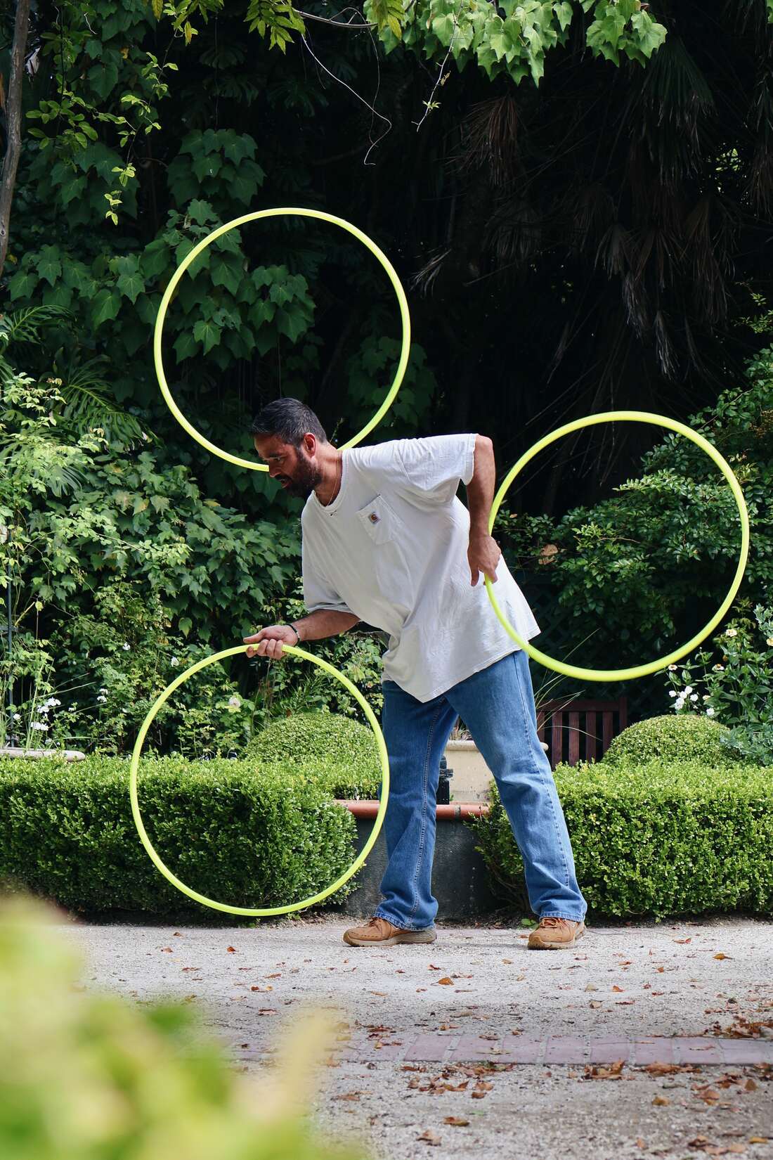 The Catching Machine juggling four hoops